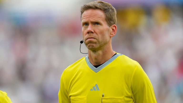 Fourth official Drew Fischer, of Canada, participates in a men's quarterfinal soccer match between Egypt and Paraguay at the 2024 Summer Olympics, Friday, Aug. 2, 2024, at Marseille Stadium in Marseille, France. (AP Photo/Julio Cortez)
